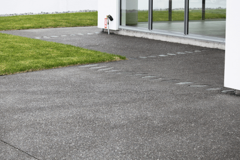 Exposed aggregate with large individual stones placed into the concrete.