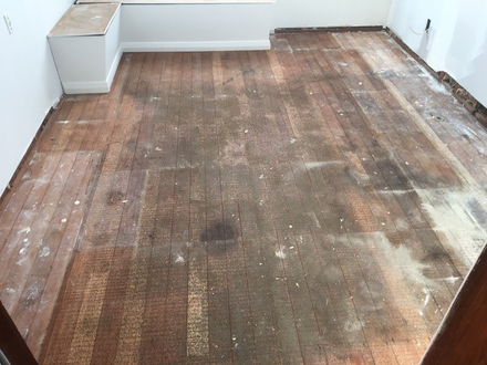 a wooden floor in need of restoration