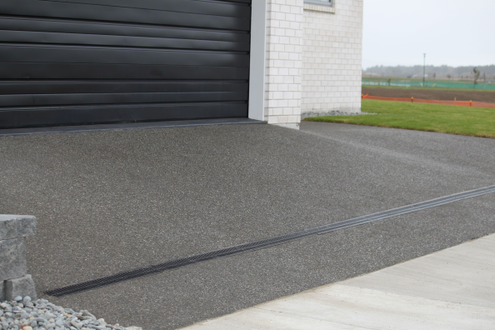 Exposed aggregate with a channel drain