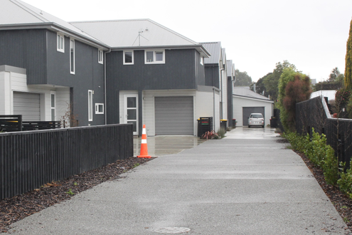 This driveway is a mix of exposed aggregate and plain concrete to separate shared and private area's.